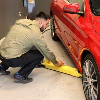 swing-maxjax-car-lift-arms-into-lift-position.jpg